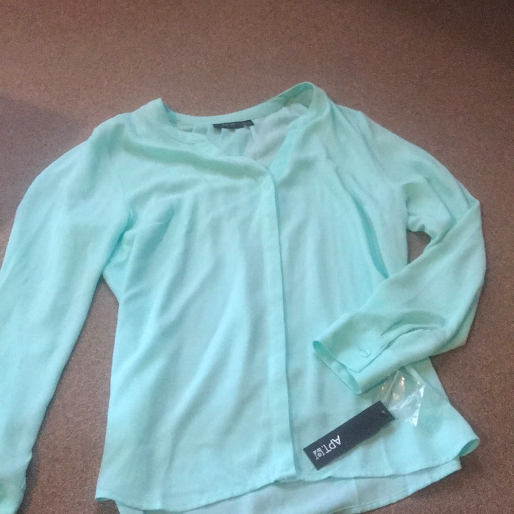 Turquoise button up shirt.